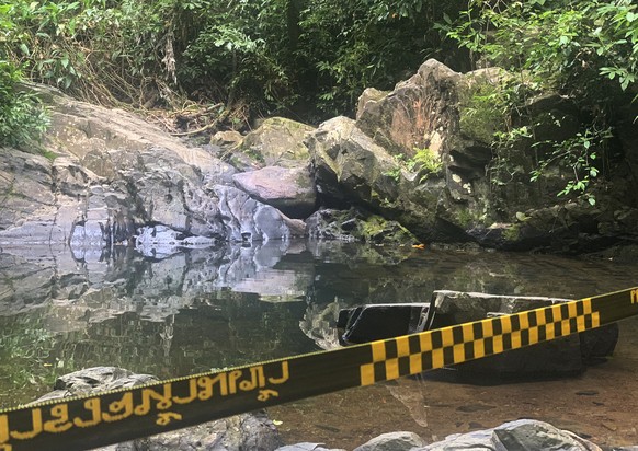 FILE - In this Aug. 6, 2021, file photo, police tape cordons off the area where a woman was found dead a day earlier at a secluded spot on the southern island of Phuket, Thailand. A suspect in the dea ...