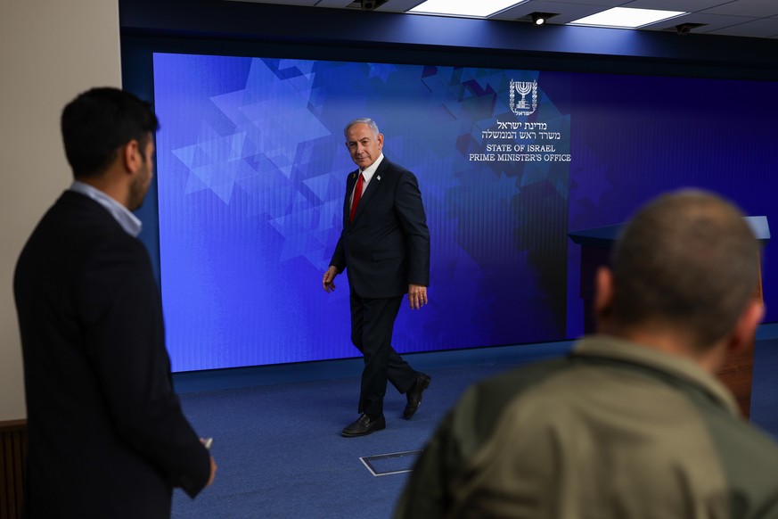 epa12123700 Israeli Prime Minister Benjamin Netanyahu (C) leaves after addressing a press conference in Jerusalem, 21 May 2025. EPA/RONEN ZVULUN / POOL
