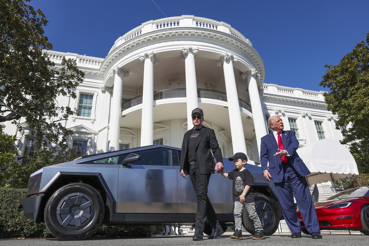 President Donald Trump and Tesla CEO Elon Musk, along with his son X � A-Xii, speak to reporters near Tesla vehicles on South Lawn of the White House Tuesday, March 11, 2025, in Washington. (Pool via  ...