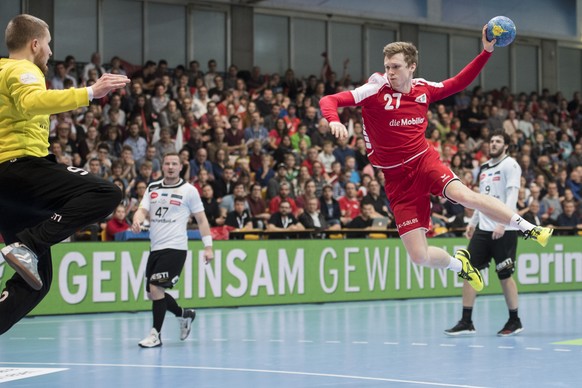 Switzerland's Maximilian Gerbl, right, fights for the ball against, Estonia's Rasmus Ots, left, during the 2019 Men's World Championship qualification game between Switzerland and Eston ...