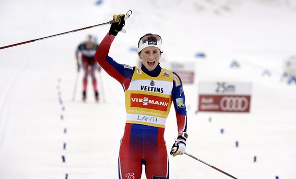 Winner Norway's Marit Björgen cheers at finish during the Ladies' World Cup 10km classic style cross country skiing competition in Lahti Ski Games in Lahti, Finland on Sunday, March 8, 2015. (AP Photo ...