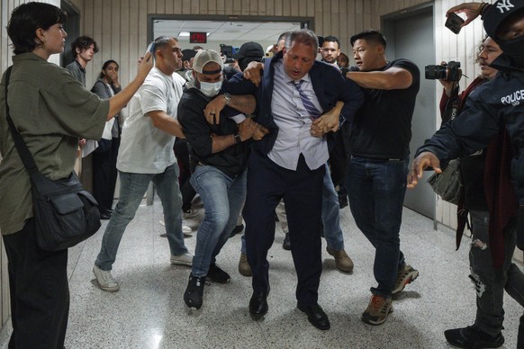 New York City Comptroller Brad Lander is placed under arrest by Immigration and Customs Enforcement (ICE) and FBI agents outside federal immigration court on Tuesday, June 17, 2025, in New York. (AP P ...