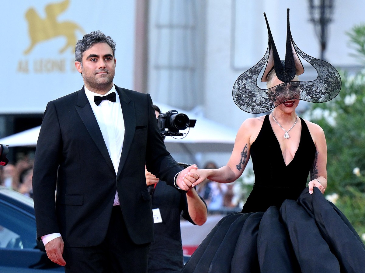 epa11584939 US singer and actor Lady Gaga (R) with Michael Polansky arrive for the premiere of 'Joker: Folie a Deux' at the 81st annual Venice International Film Festival, in Venice, Italy,  ...