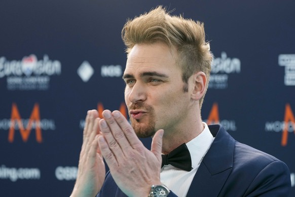 epa09205520 Uku Suviste from Estonia arrives on the Turquoise Carpet for the Opening Ceremony of the 65th annual Eurovision Song Contest (ESC) at the Rotterdam Cruise Terminal, in Rotterdam, The Nethe ...