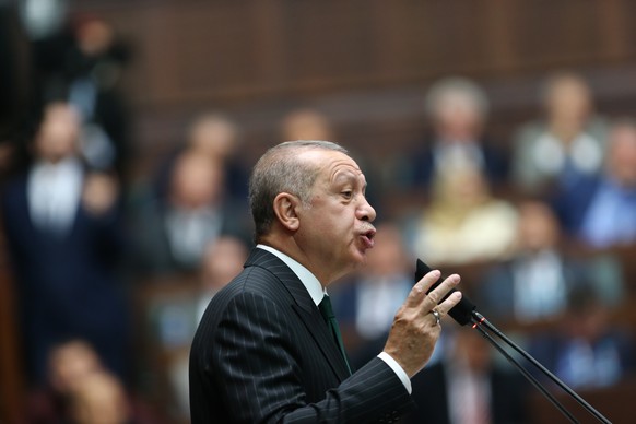 Turkey&#039;s President Recep Tayyip Erdogan delivers a speech to MPs of his ruling Justice and Development Party (AKP) at the parliament in Ankara, Turkey, Tuesday, Nov. 20, 2018. (AP Photo/Burhan Oz ...