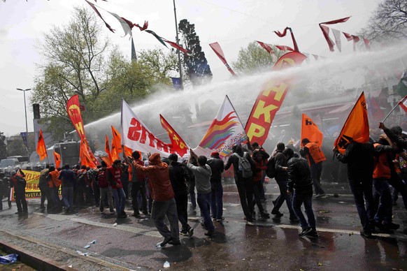 Police uses a water cannon against protesters in Besiktas neighbourhood of Istanbul, Turkey, May 1, 2015. Turkish police used water cannon and tear gas on hundreds of stone-throwing protesters on Frid ...