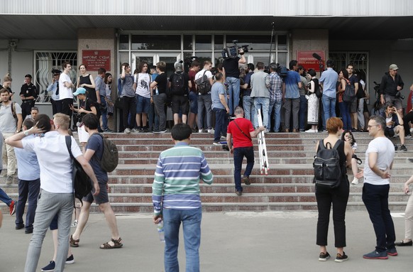 epa07634606 Journalists and supporters of the Meduza news project journalist Ivan Golunov gather near Nikulinsky court for his pre-trial hearing in Moscow, Russia, 08 June 2019. Meduza special corresp ...