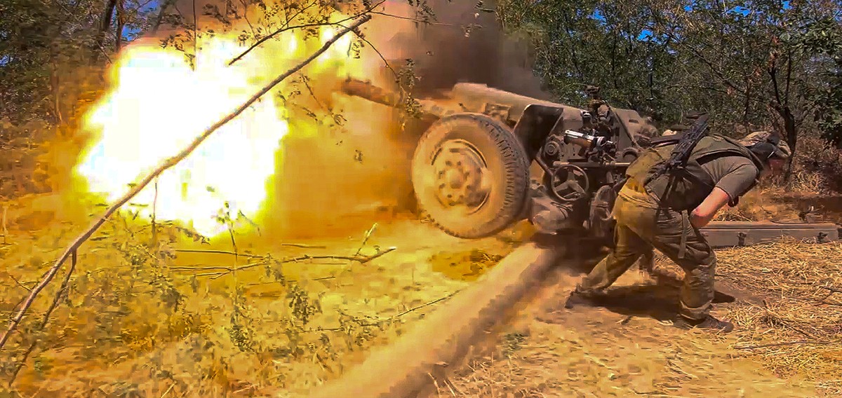 In this photo taken from a video released by the Russian Defense Ministry on Thursday, Aug. 22, 2024, a Russian soldier fires from D-30 howitzer towards Ukrainian positions in an undisclosed location  ...