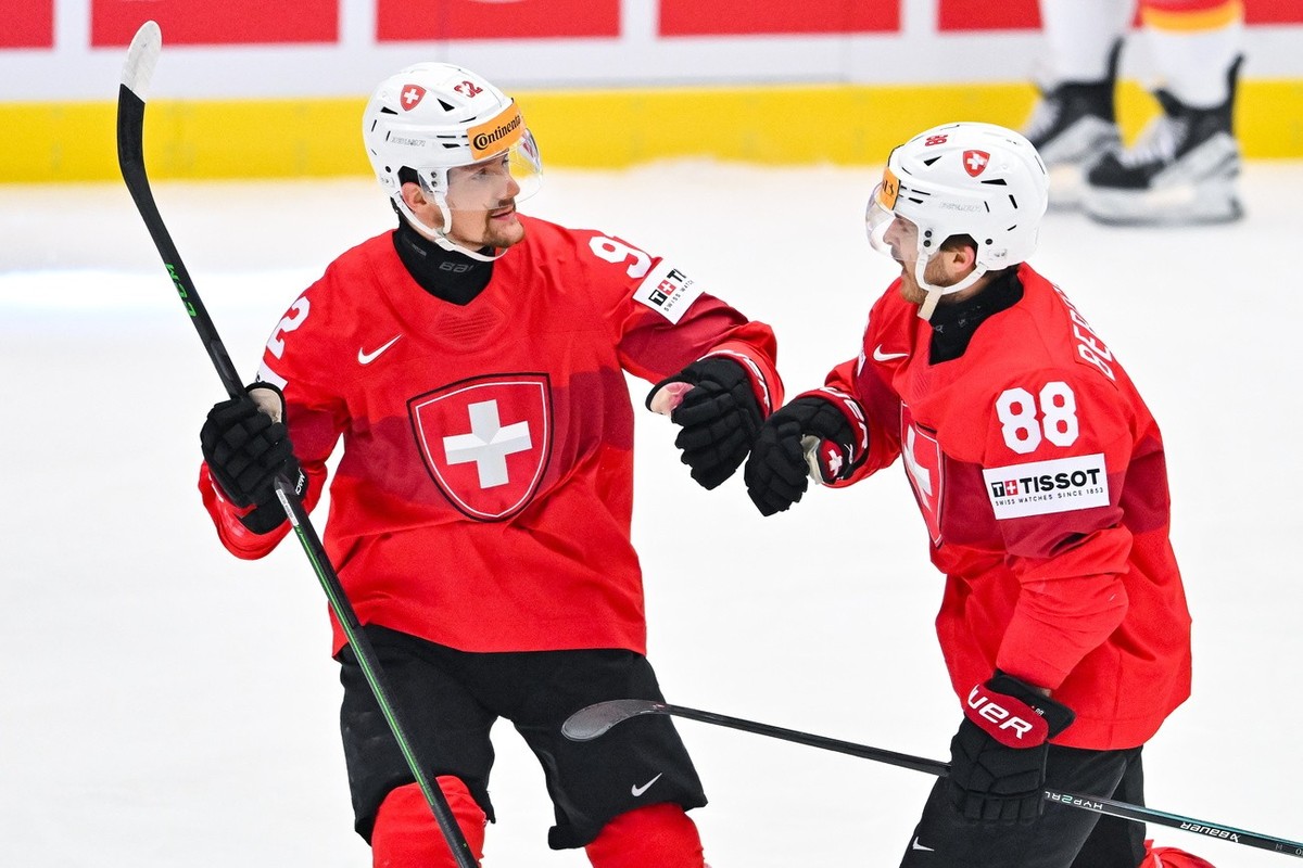 epa11363467 Christoph Bertschy of Switzerland (R) and Gaetan Haas of Switzerland (L) celebrate after scoring during the IIHF Ice Hockey World Championship 2024 quarter-final match between Switzerland  ...