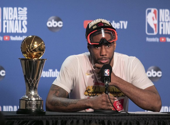 June 13, 2019 - Oakland, California, United States of America - Kawhi Leonard 2 of the Toronto Raptors speaks with the media after defeating the Golden State Warriors to win Game 6 of the 2019 NBA, Ba ...