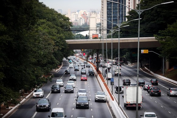 epa08420085 General view of an avenue with vehicle traffic, in Sao Paulo, Brazil, 13 May 2020. Brazil faces the growing advance of the disease amid a pulse between the governors and the President, who ...