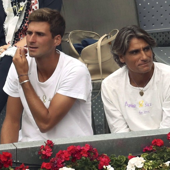 Serbian tennis player and Novak Djokovic s brother, Marko Djokovic (L) and Novak Djokovic s mental coach, Spanish Pepe Imaz (C), look Spanish Nicolas Almagro against Serbian Novak Djokovic match at th ...