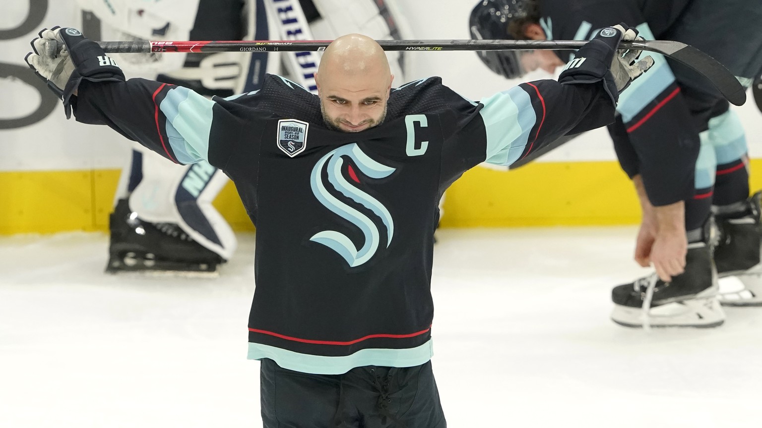 Seattle Kraken defenseman Mark Giordano holds his stick during warmups before an NHL hockey game against the Tampa Bay Lightning, Wednesday, March 16, 2022, in Seattle. Giordano was honored before the ...