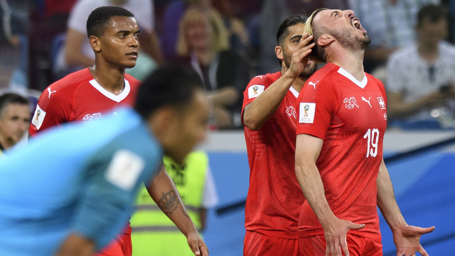 Switzerland&#039;s forward Josip Drmic, right, celebrates after scoring the 2 -1 goal with Switzerland&#039;s defender Manuel Akanji, left, and Switzerland&#039;s defender Ricardo Rodriguez, center, d ...