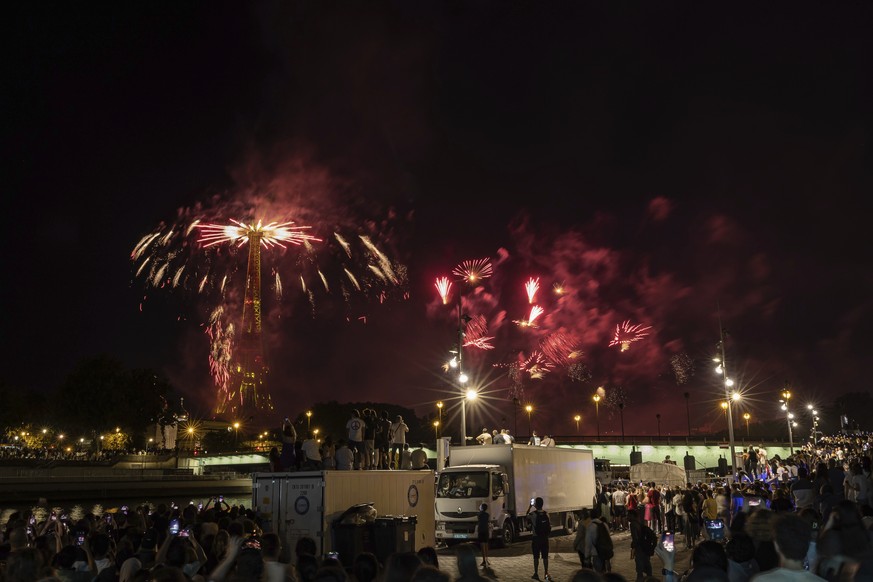 CORRECTS DAY TO FRIDAY INSTEAD OF THURSDAY - Fireworks illuminate the Eiffel Tower in Paris, during Bastille Day celebrations late Friday, July 14, 2023. (AP Photo/Aurelien Morissard)