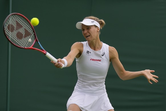 Switzerland&#039;s Viktorija Golubic returns the ball to Germany&#039;s Andrea Petkovic during their singles tennis match on day two of the Wimbledon tennis championships in London, Tuesday, June 28,  ...