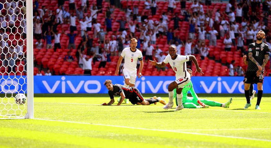 epa09267364 Raheem Sterling (C-R) of England celebrates after scoring the 1-0 lead during the UEFA EURO 2020 group D preliminary round soccer match between England and Croatia in London, Britain, 13 J ...