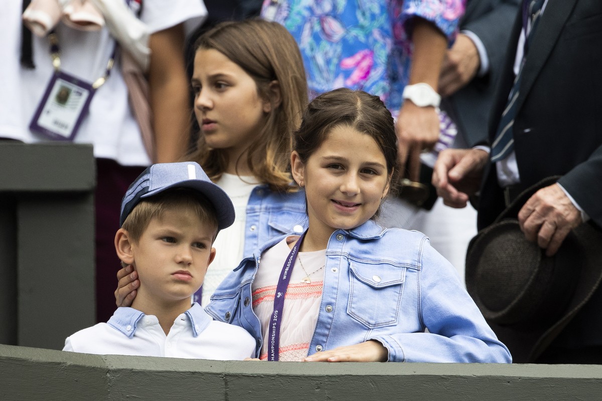 epa07690129 Roger Federer's children sit in the box during Federer's first round match against Lloyd Harris of South Africa, at the All England Lawn Tennis Championships in Wimbledon, London ...