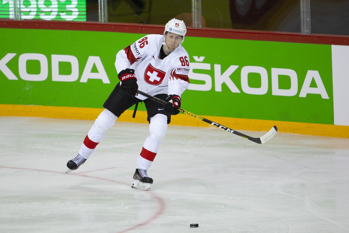 Switzerland's defender Janis Jerome Moser passes the puck, during the IIHF 2021 World Championship preliminary round game between Belarus and Switzerland, at the Olympic Sports Center, in Riga, L ...
