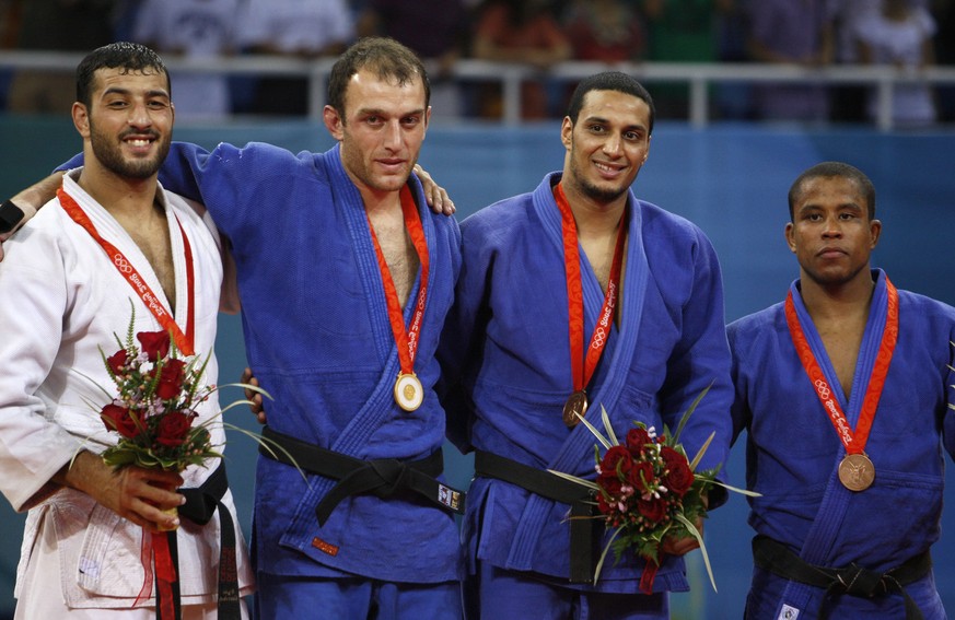 From left, silver medalist Amar Benikhlef of Algeria, gold medalist Irakli Tsirekidze of Georgia, bronze medalist Hesham Mesbah of Egypt, and bronze medalist Sergei Aschwanden of Switzerland pose with ...