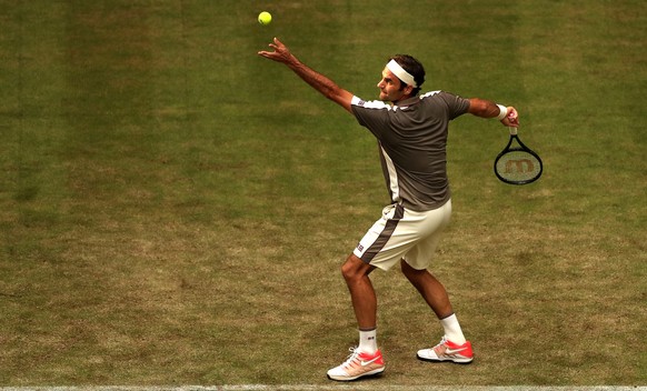 epa07656378 Roger Federer from Switzerland in action during his first round match against John Millman from Australia at the ATP Tennis Tournament Gerry Weber Open in Halle Westphalia, Germany, 18 Jun ...