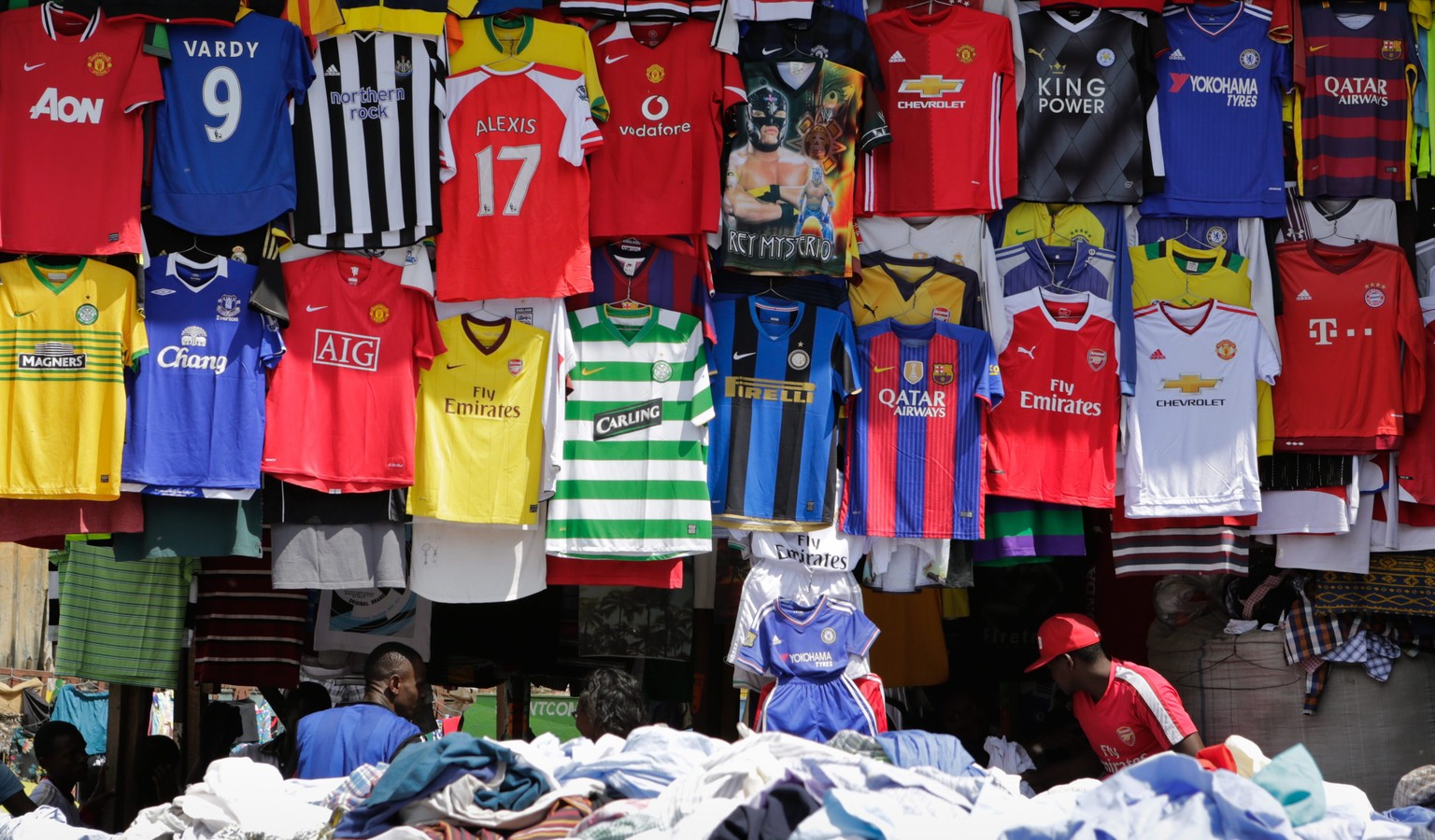 epa05443683 Secondhand sport jerseys are displayed at a stall at the Gikomba open-air market in Nairobi, Kenya, 27 July 2016. Gikomba market is said to be the biggest secondhand clothes market in East ...