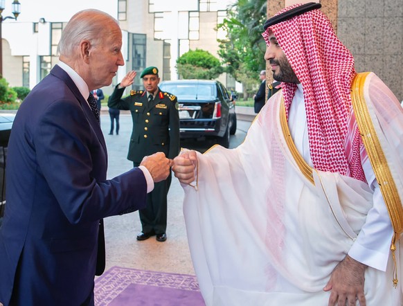 CORRECTS SOURCE TO SAUDI ROYAL PALACE, NOT SAUDI PRESS AGENCY (SPA), ADDS BYLINE - In this image released by the Saudi Royal Palace, Saudi Crown Prince Mohammed bin Salman, right, greets President Joe ...