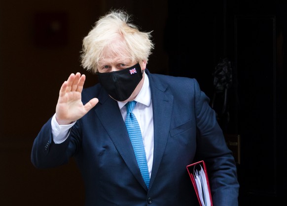 epa09343733 British Prime Minister Boris Johnson departs 10 Downing Street for Prime Minister Questions at parliament in London, Britain, 14 July 2021. Johnson faces the MPs&#039; weekly question time ...