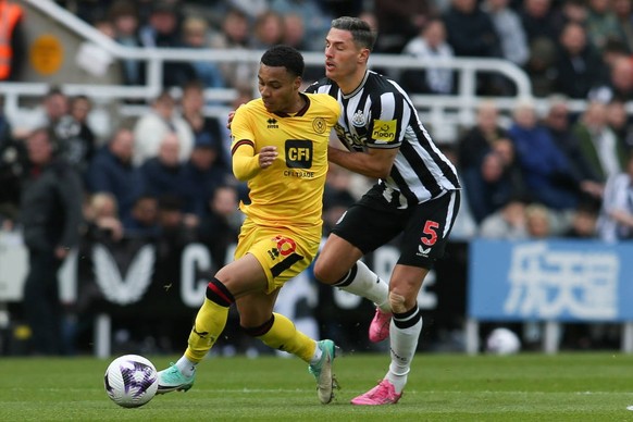 Newcastle United v Sheffield United - Premier League Cameron Archer of Sheffield United is breaking away from Newcastle United s Fabian Schar during the Premier League match between Newcastle United a ...
