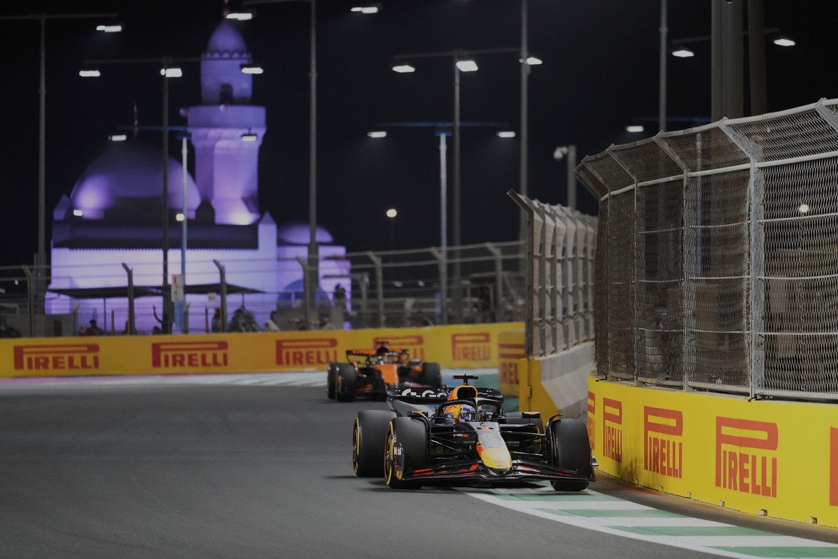 Red Bull driver Max Verstappen of the Netherlands steers his car followed by McLaren driver Oscar Piastri of Australia during the Formula One Saudi Arabian Grand Prix at the Jeddah Corniche Circuit in ...