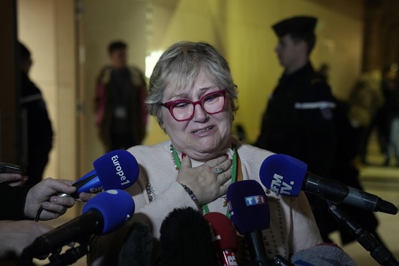 Injured victim, Nadege Renda reacts at the end of the Nice attacks trial at the temporary Courtroom, in Paris, Tuesday, Dec. 13, 2022. A French court has given its verdict Tuesday in a trial over a tr ...