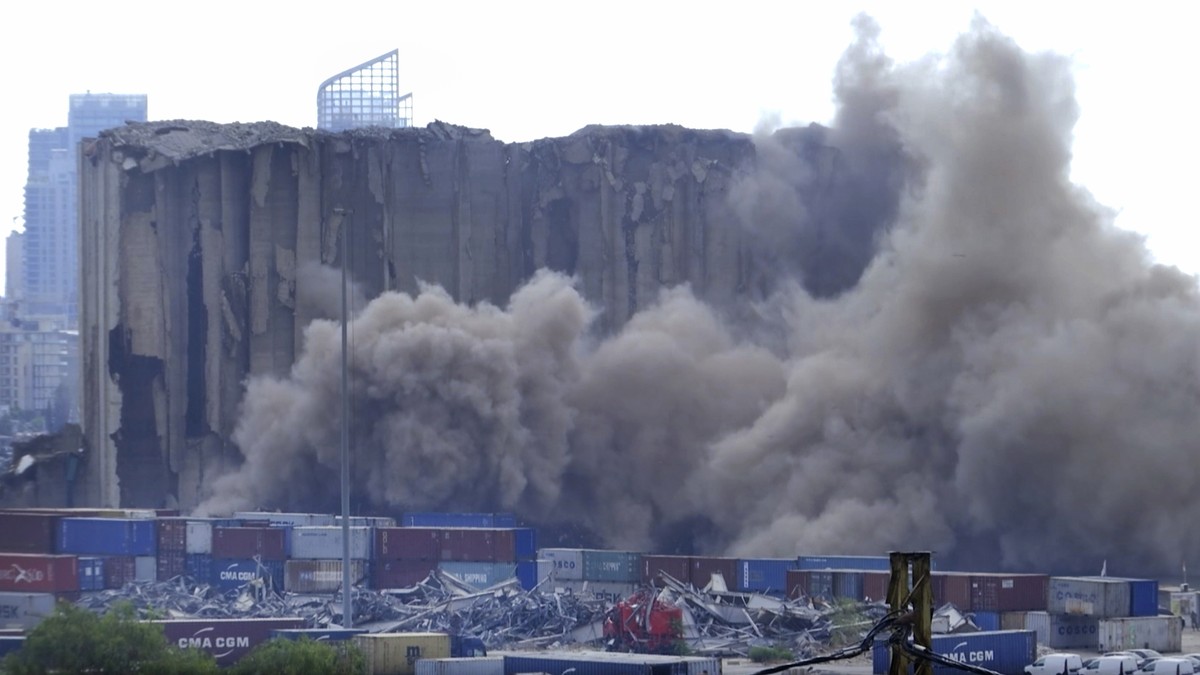 This frame grab from video shows dust rising from silos in the port of Beirut, Lebanon, Sunday, July 31, 2022. A section of Beirut's massive port grain silos, shredded in the 2020 explosion, coll ...