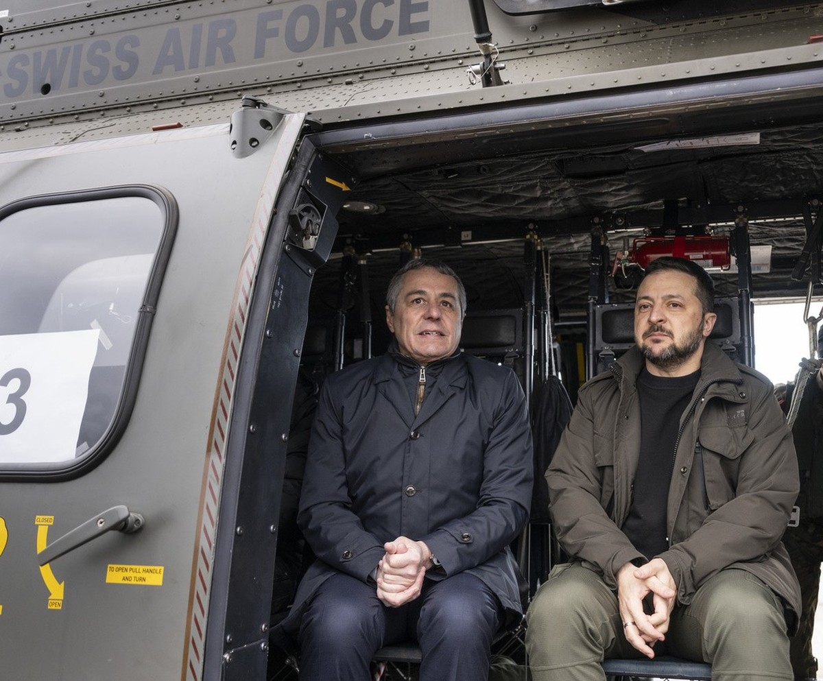 Switzerland's Foreign Minister Federal Councillor Ignazio Cassis, left, and his State guest Volodymyr Zelenskyy, President of Ukraine, right, get ready for takeoff in a Super Puma Helicopter of t ...
