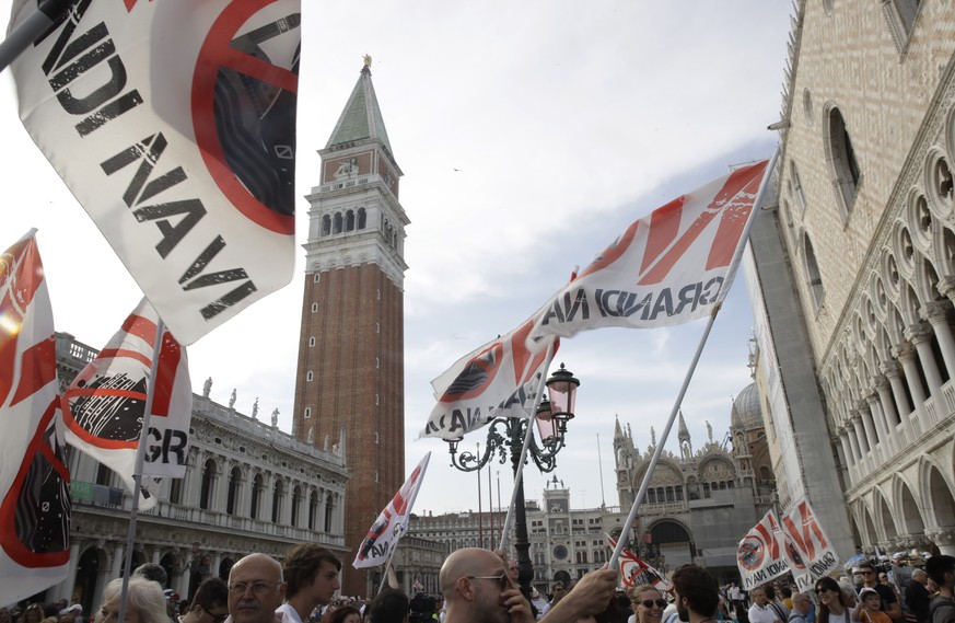 Demonstrators gather near St. Mark&#039;s Square during a protest against cruise ships being allowed in the lagoon, in Venice, Italy, Saturday, June 8, 2019. Venice environmentalists have long complai ...