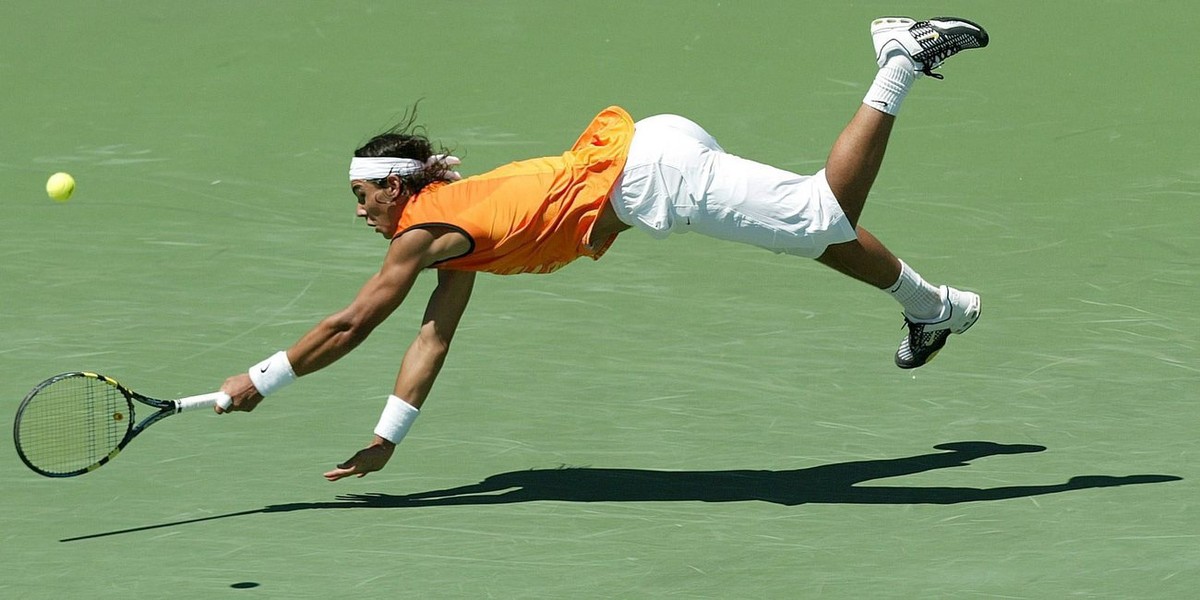 Roger Federer of Switzerland celebrates a point during his match against Andre Agassi of the USA during their semifinal match at the Nasdaq-100 Open in Key Biscayne, Florida Friday 01 April 2005. Fede ...