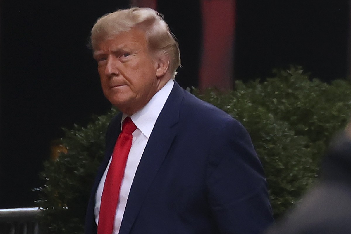 Former President Donald Trump arrives at Trump Tower, Monday, April 3, 2023, in New York. Trump arrived in New York on Monday for his expected booking and arraignment the following day on charges aris ...