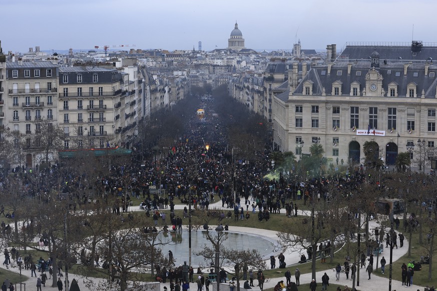 Demonstrators march during a demonstration, Tuesday March 7, 2023 in Paris.  Hundreds of thousands of protesters across France took part in a new round of anti-government protests and strikes on Tuesday…