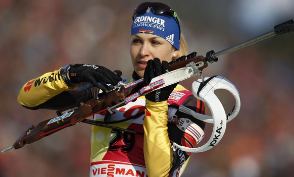 Magdalena Neuner of Germany prepares for a warm up shooting prior to the Women&#039;s 7.5 km Sprint competition at the Biathlon World Championships in Ruhpolding, Germany, Saturday, March 3, 2012. (AP ...