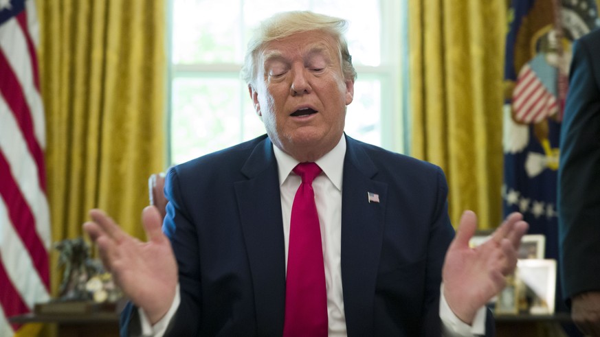 President Donald Trump speaks after signing an executive order to increase sanctions on Iran, in the Oval Office of the White House, Monday, June 24, 2019, in Washington. Trump is accompanied by Treas ...