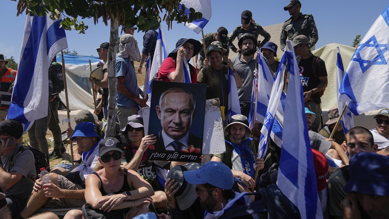 Israelis protest plans by Prime Minister Benjamin Netanyahu's government to overhaul the justice system, outside the Knesset, Israel's parliament, in Jerusalem, Monday, July 24, 202...