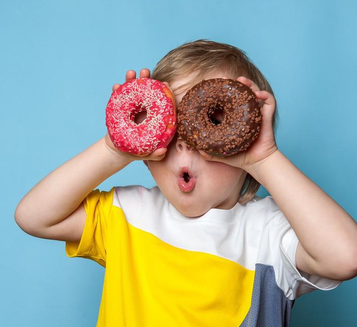 Kind Übergewicht Donuts