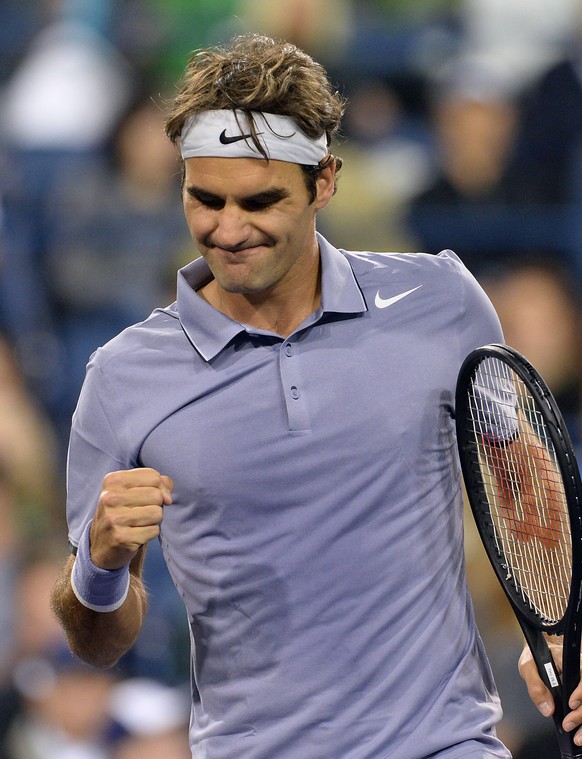 Mar 13, 2014; Indian Wells, CA, USA;  Roger Federer (SUI) reacts after winning the first set of his quarter final match against  Kevin Anderson (RSA) at the BNP Paribas Open at the Indian Wells Tennis Garden.  Federer won 7-5, 6-1.  Mandatory Credit: Jayne Kamin-Oncea-USA TODAY Sports