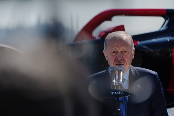Turkey's President Recep Tayyip Erdogan gives a speech at Dolmabahce palace in Istanbul, Turkey, Friday, April 24, 2026, during an event to announce that Turkish Grand Prix is back on the Formula ...