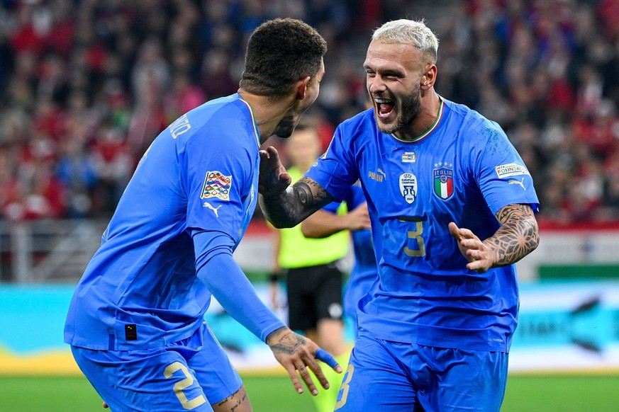 epa10208249 Federico Dimarco (R) of Italy celebrates after scoring his side's second goal during the UEFA Nations League Division A, Group 3 soccer match between Hungary and Italy at Puskas Arena, Bud ...