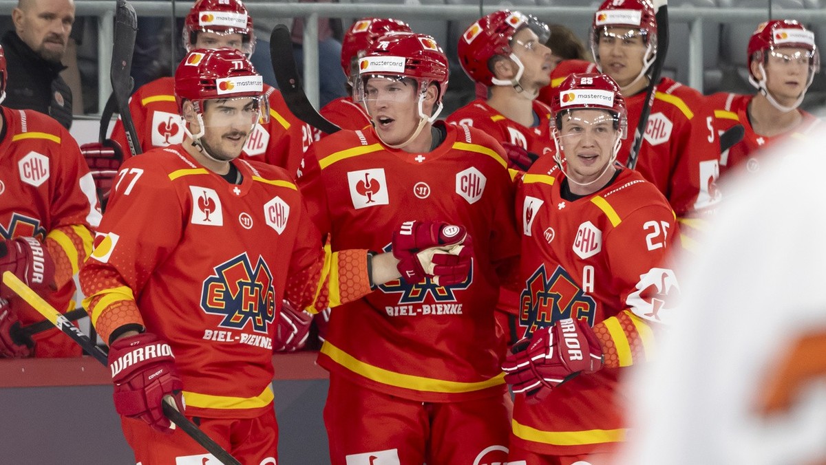 Biel?s Jere Sallinen, center, celebrates after scoring a goal 3-1 with Biel?s Robin Grossmann, left, and Biel?s Toni Rajala, right, during the Champions Hockey League match between Switzerland's  ...