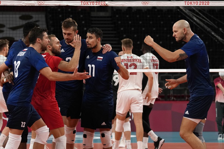 Poland team members celebrate winning a point during the men&#039;s volleyball preliminary round pool A match between Poland and Canada at the 2020 Summer Olympics, Sunday, Aug. 1, 2021, in Tokyo, Jap ...