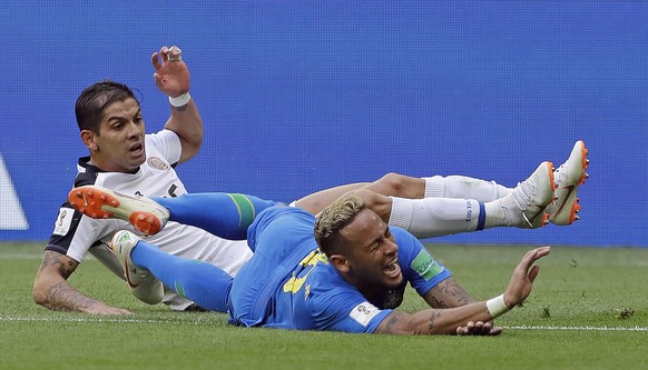 Brazil&#039;s Neymar is brought down by Costa Rica&#039;s Cristian Gamboa during the group E match between Brazil and Costa Rica at the 2018 soccer World Cup in the St. Petersburg Stadium in St. Peter ...