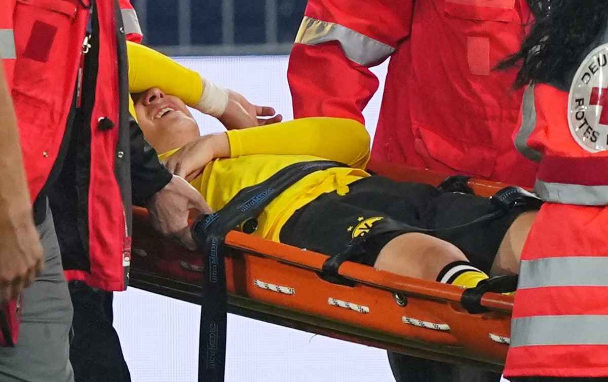 Dortmund's Konstantinos Karetsas is carried off the pitch by medical staff during the Champions League opening phase soccer match between Borussia Dortmund and Villarreal in Dortmund, Germany, Tu ...