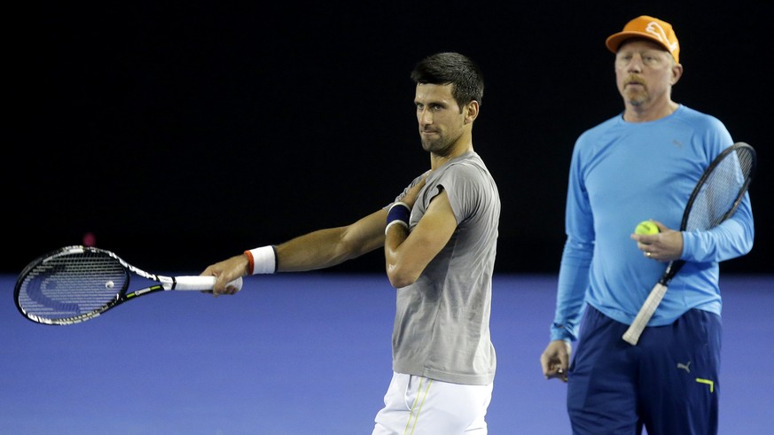 Serbia&#039;s Novak Djokovic, right, walks with his coach Boris Becker during a training session on Rod Laver Arena ahead of the Australian Open tennis championships in Melbourne, Australia, Thursday, ...