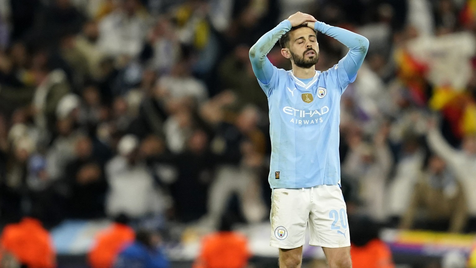 Manchester City&#039;s Bernardo Silva reacts after losing the Champions League quarterfinal second leg soccer match against Real Madrid at the Etihad Stadium in Manchester, England, Wednesday, April 1 ...